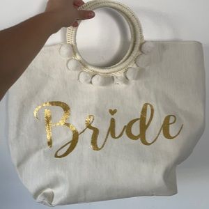Bride bag. Used once. Missing a few Pom poms